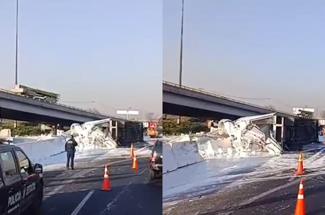 Servicios de emergencia trabajan en el retiro de un tráiler volcado y el derrame de pintura blanca